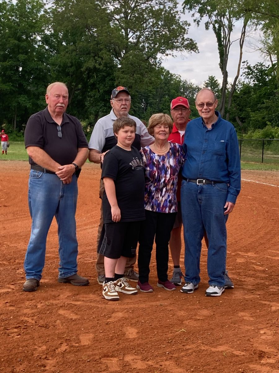 Linda (Hulett) Bond throwing out the first pitch 